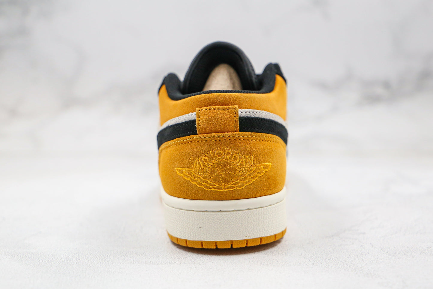 Jordan 1 Low University Gold Schwarz